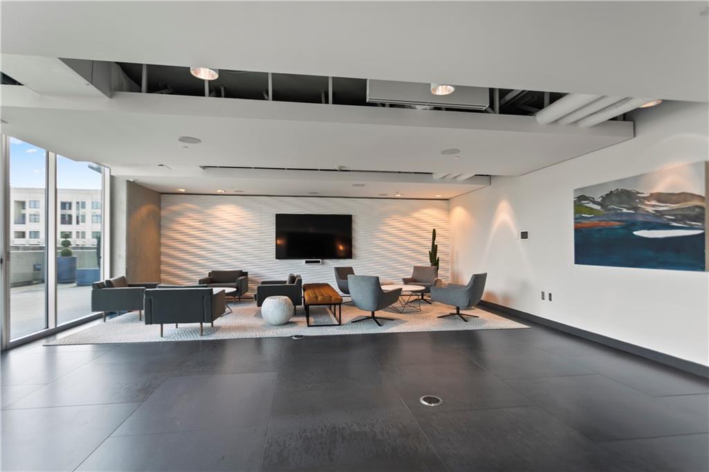 361 17th Street Northwest, Unit 1906 Atlanta, GA 30363 - Photo 24 of 28 a kitchen with a counter space a sink and a window