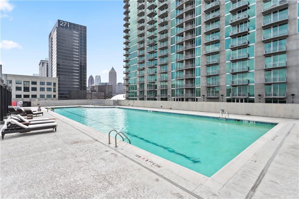 361 17th Street Northwest, Unit 1906 Atlanta, GA 30363 - Photo 26 of 28 a swimming pool with outdoor space and seating area