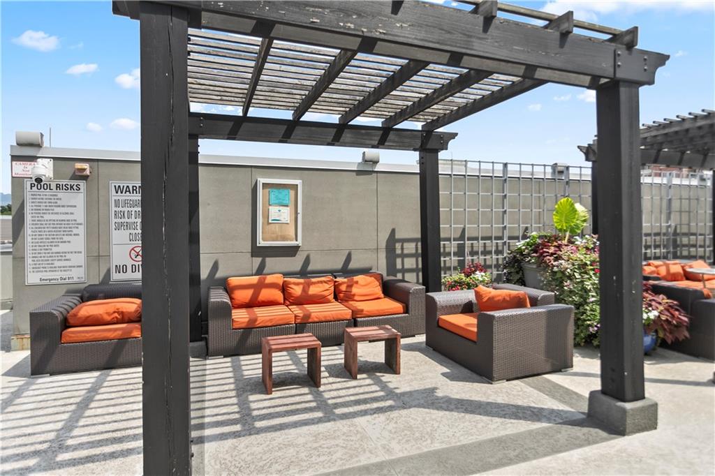 361 17th Street Northwest, Unit 1906 Atlanta, GA 30363 - Photo 27 of 28 a outdoor space with patio lots of furniture