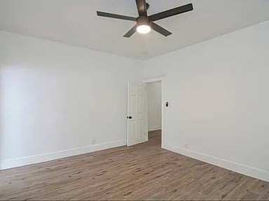 27 Hosmer Street, Unit 2 Boston, MA 02126 - Photo 17 of 20 a view of empty room with wooden floor