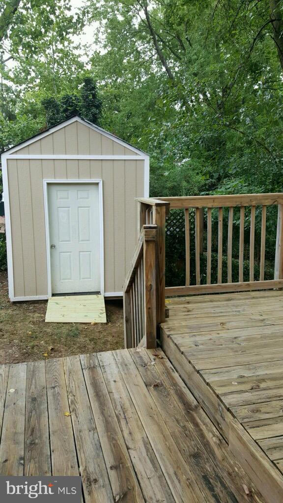 7743 Normandy Road Landover, MD 20785 - Photo 11 of 15 a house with trees in the background