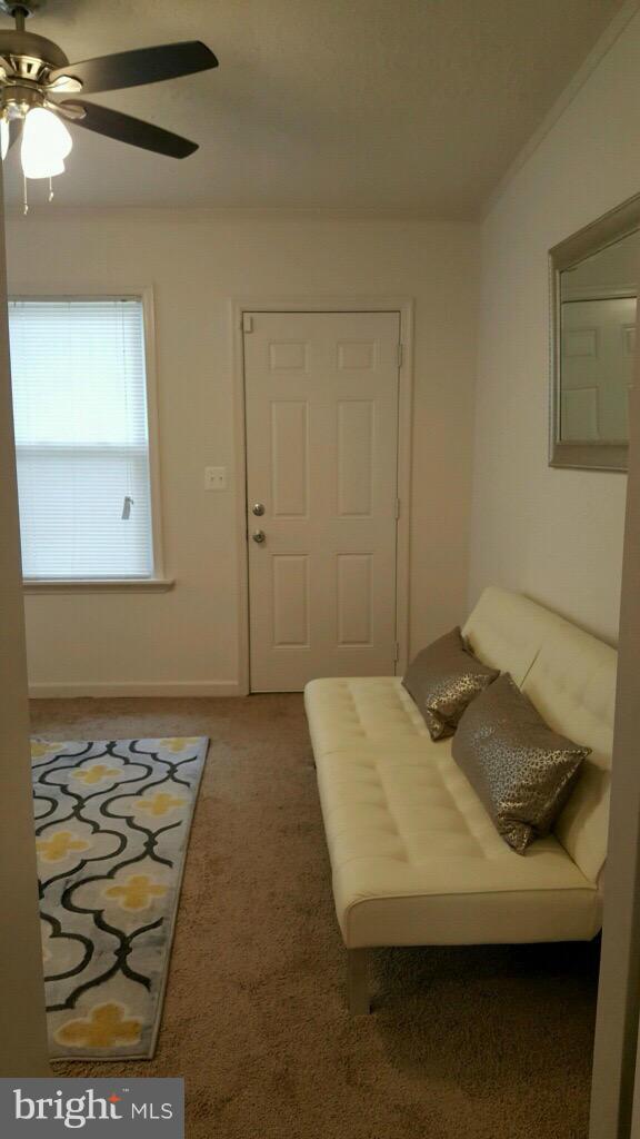 7743 Normandy Road Landover, MD 20785 - Photo 14 of 15 a bedroom with a bed and cabinets