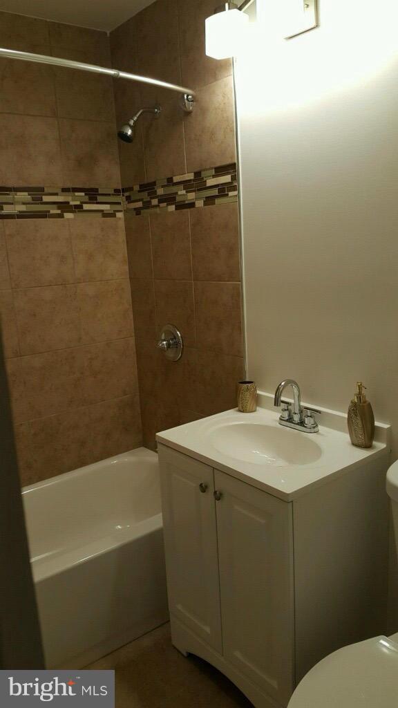 7743 Normandy Road Landover, MD 20785 - Photo 15 of 15 a bathroom with a sink and a bathtub