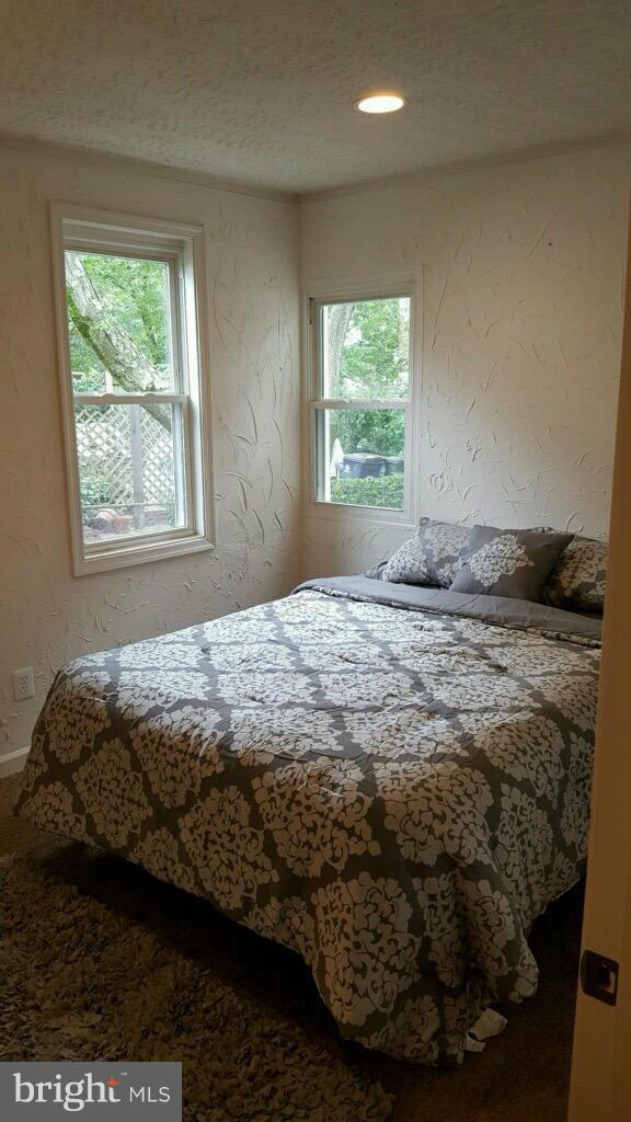 7743 Normandy Road Landover, MD 20785 - Photo 6 of 15 a bedroom with a bed and a window
