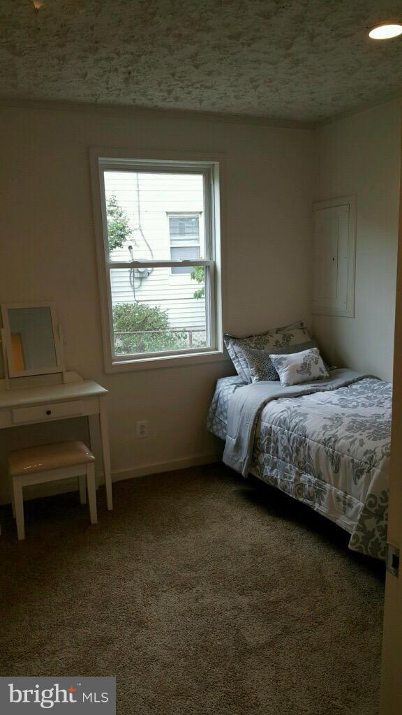 7743 Normandy Road Landover, MD 20785 - Photo 10 of 15 a bedroom with a bed and a window