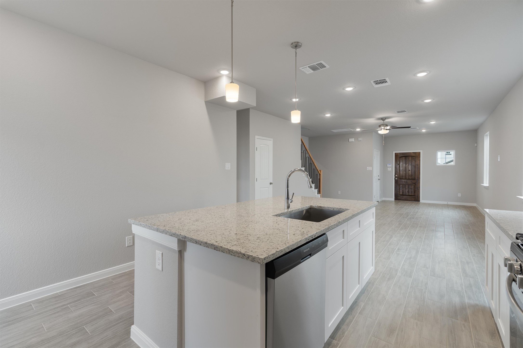 340 Stellar Wind Drive Georgetown, TX 78628 - Photo 12 of 31 a kitchen with a sink and a refrigerator