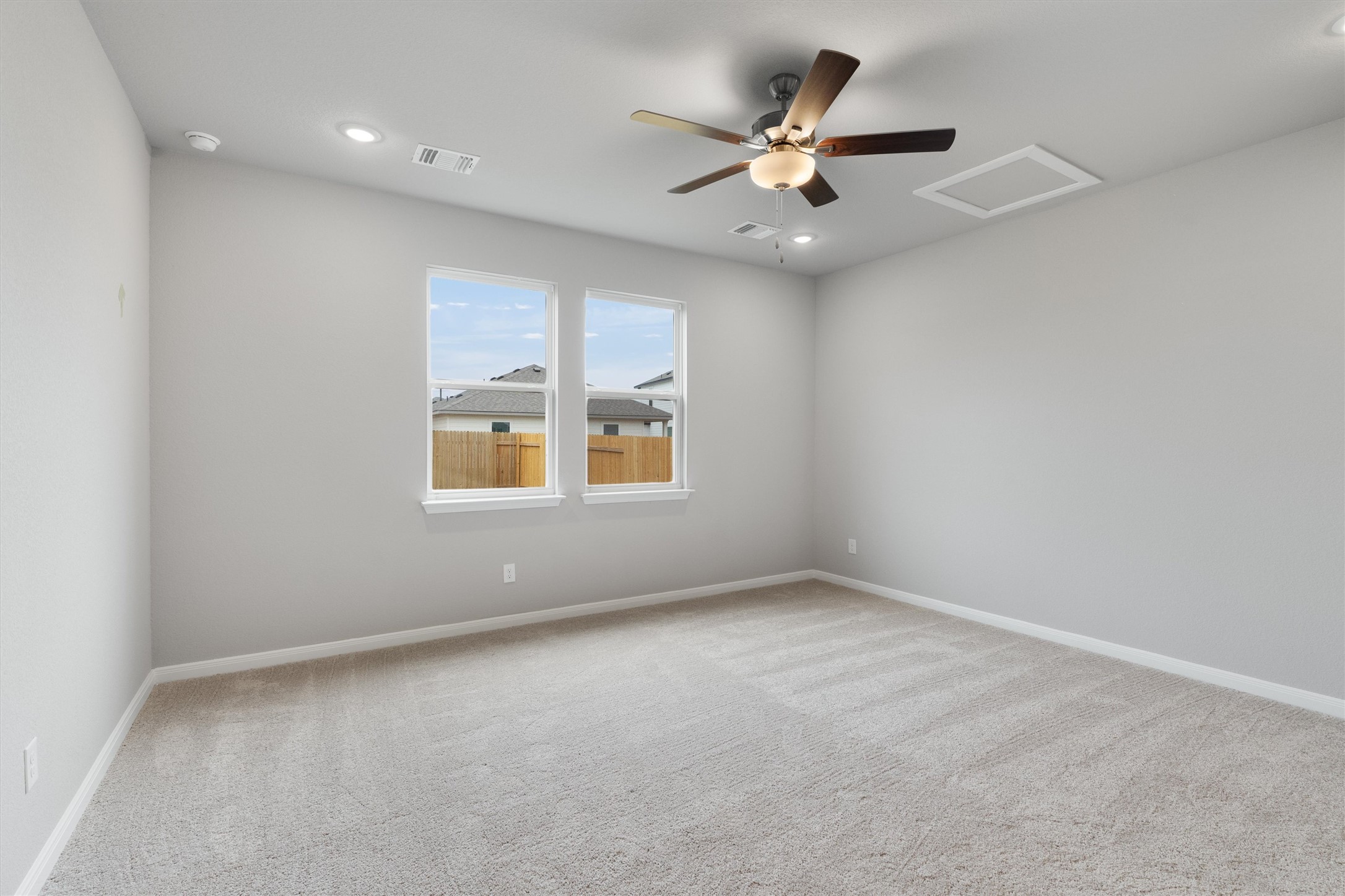 340 Stellar Wind Drive Georgetown, TX 78628 - Photo 13 of 31 an empty room with a window and a fan
