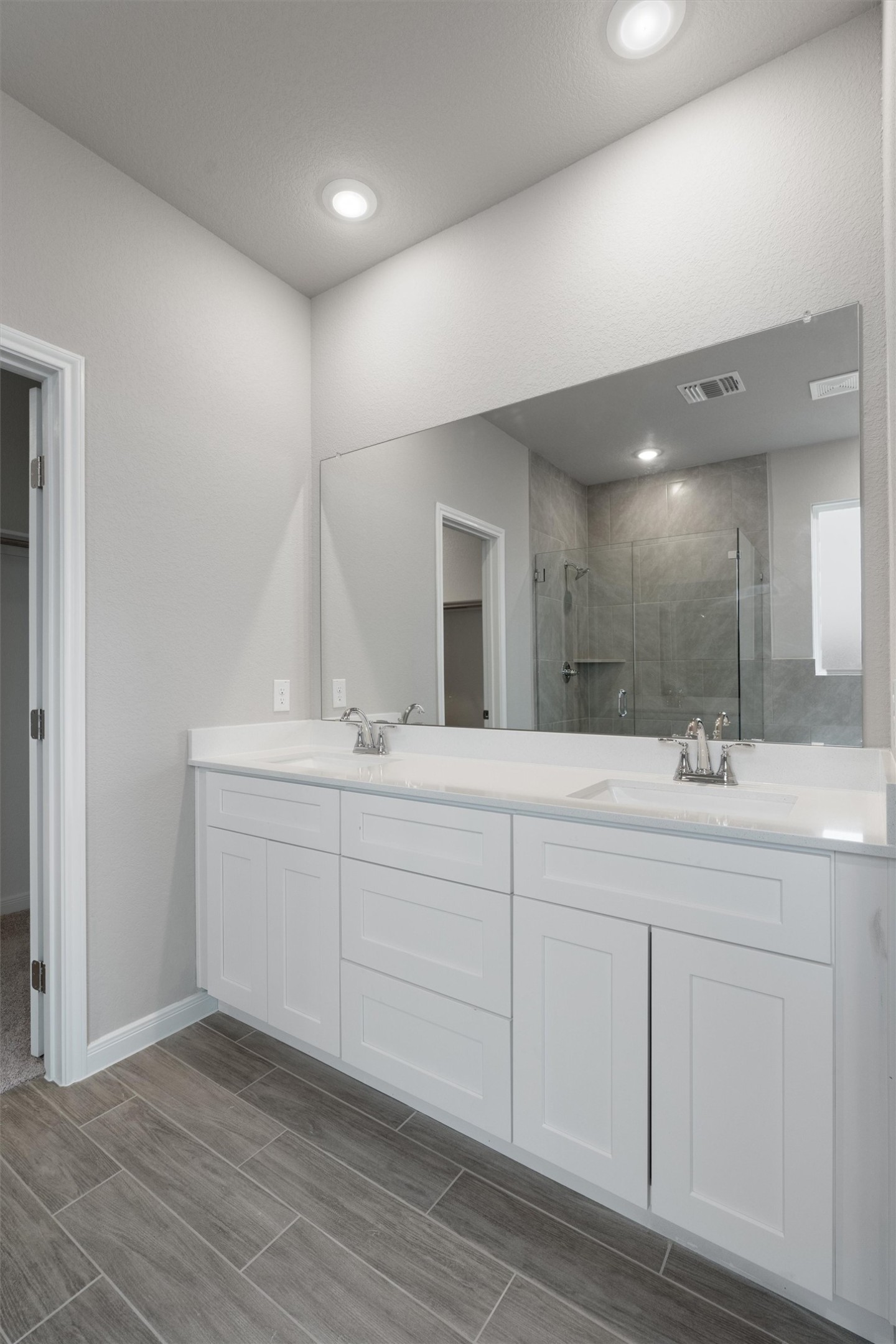 340 Stellar Wind Drive Georgetown, TX 78628 - Photo 15 of 31 a bathroom with a double vanity sink and mirror