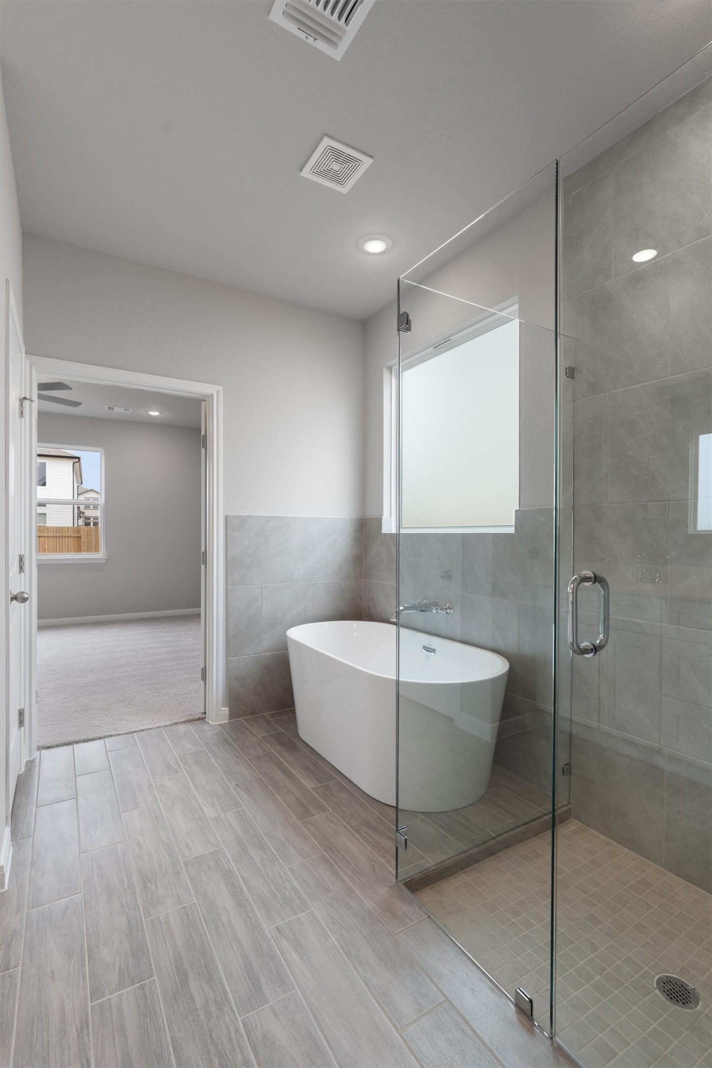 340 Stellar Wind Drive Georgetown, TX 78628 - Photo 16 of 31 a bathroom with a bathtub and shower