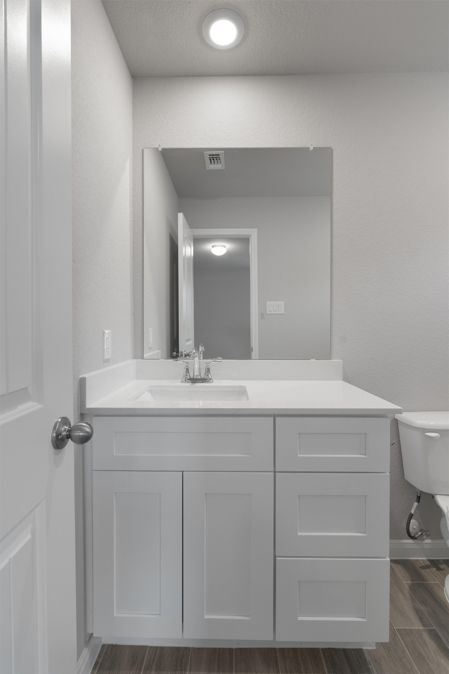 340 Stellar Wind Drive Georgetown, TX 78628 - Photo 24 of 31 a bathroom with a sink vanity and mirror