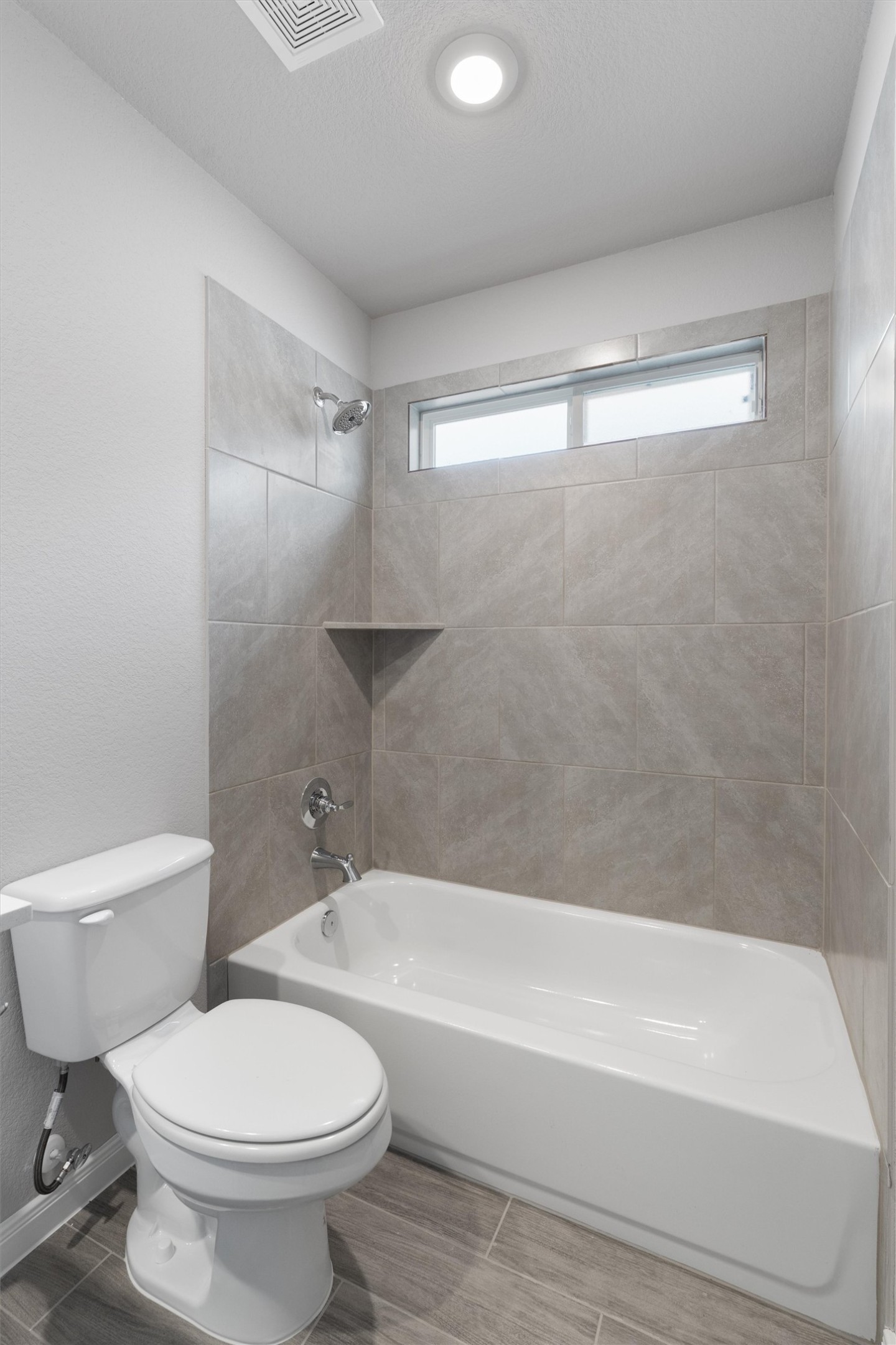 340 Stellar Wind Drive Georgetown, TX 78628 - Photo 25 of 31 a bathroom with a toilet and a bathtub