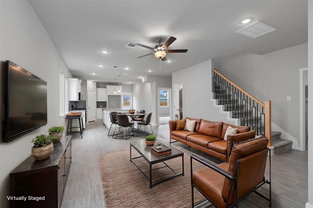 340 Stellar Wind Drive Georgetown, TX 78628 - Photo 3 of 31 a living room with furniture and a flat screen tv