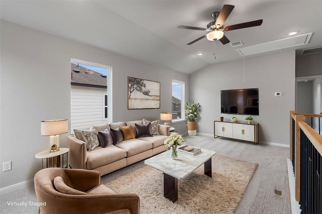 340 Stellar Wind Drive Georgetown, TX 78628 - Photo 4 of 31 a living room with furniture and a flat screen tv
