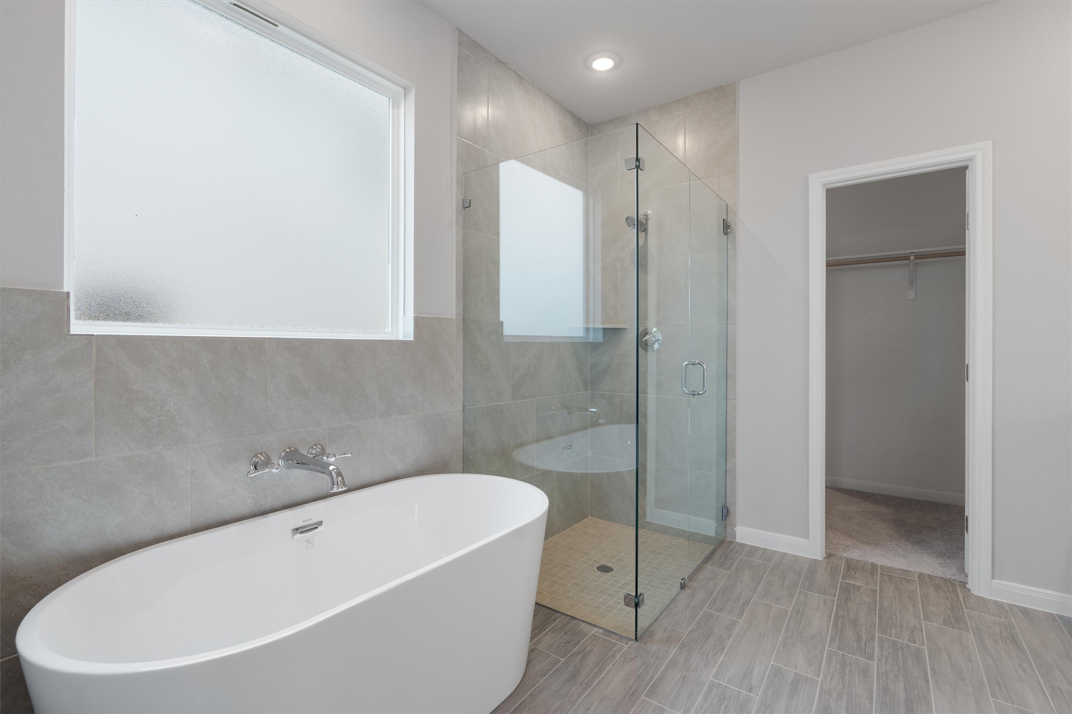 340 Stellar Wind Drive Georgetown, TX 78628 - Photo 6 of 31 a white bath tub sitting next to a white toilet