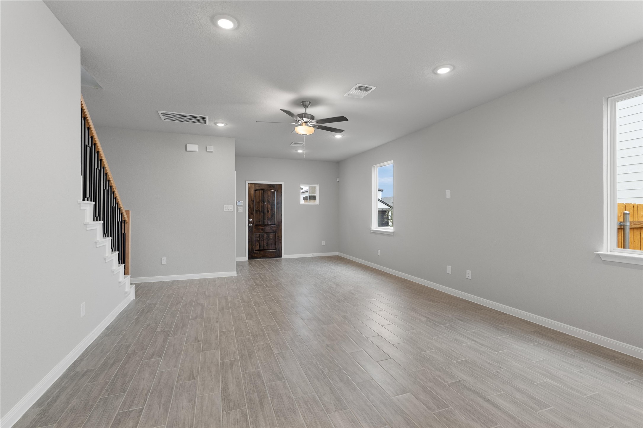 340 Stellar Wind Drive Georgetown, TX 78628 - Photo 8 of 31 wooden floor in an empty room with a window
