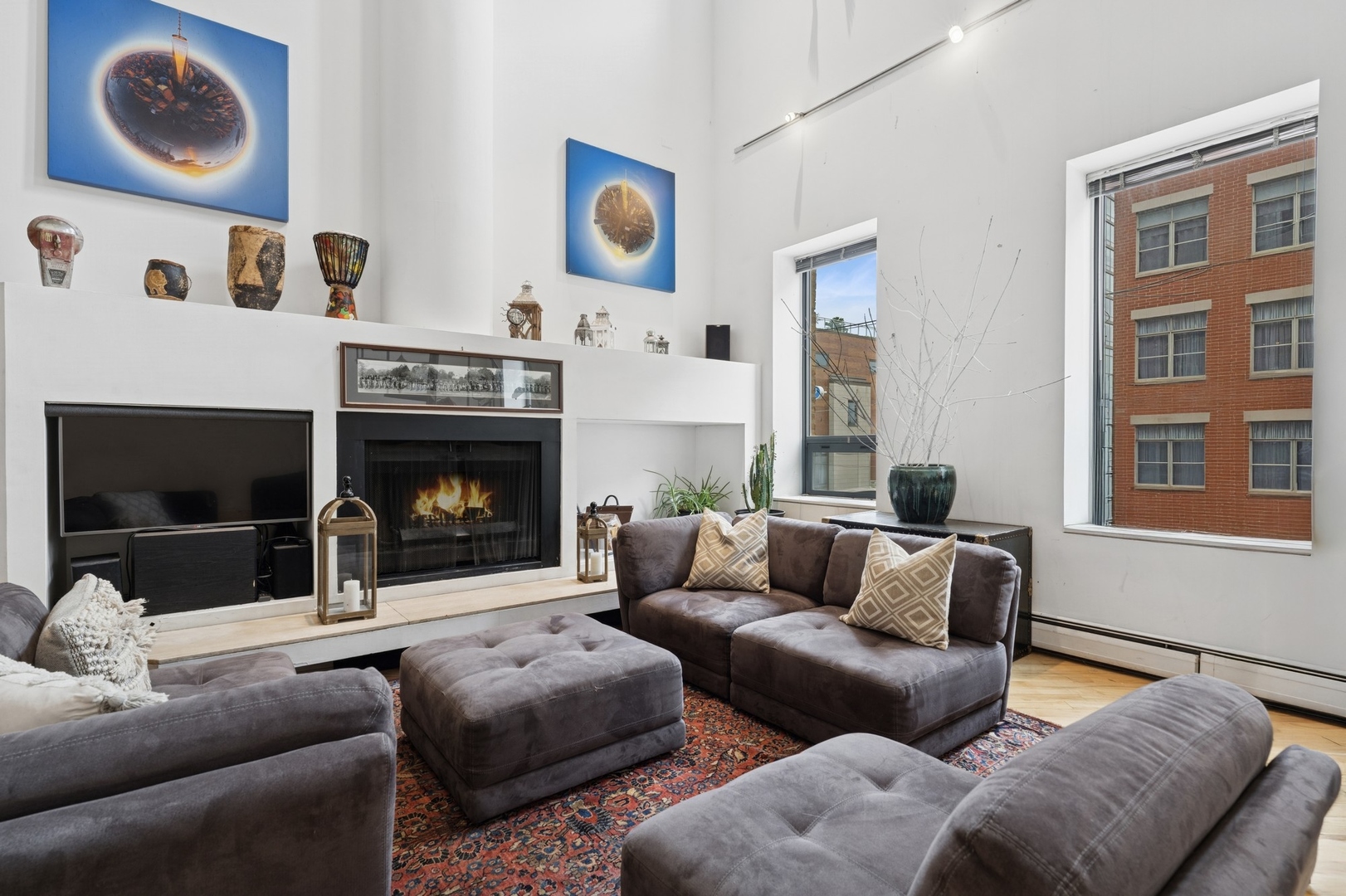 711 North Milwaukee Avenue, Unit 2 Chicago, IL 60642 - Photo 8 of 27 a living room with furniture and a fireplace