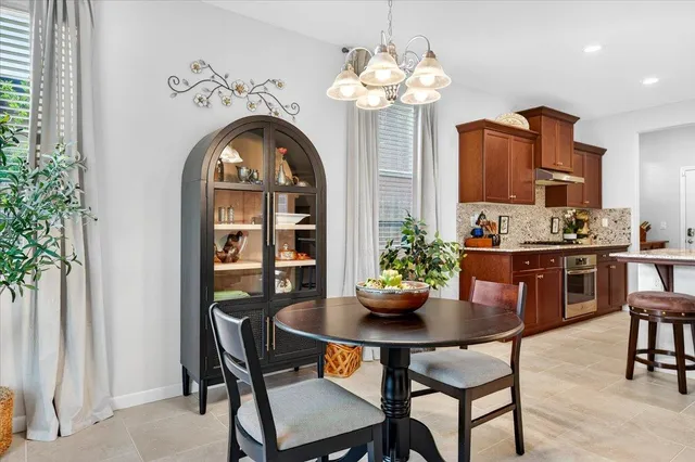 a bed room with a bed and a chandelier