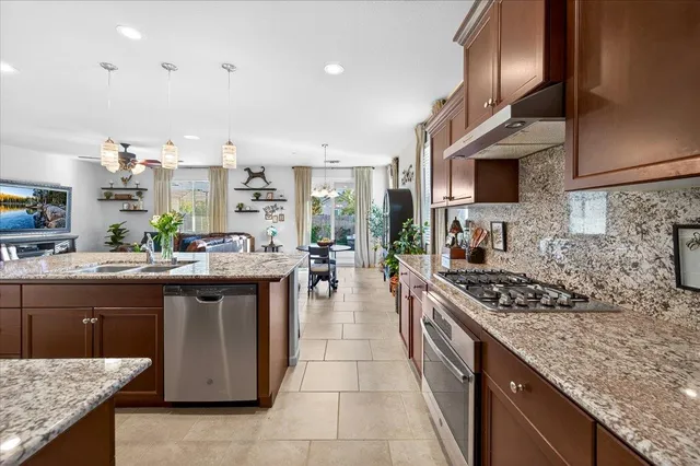 a view of a house with backyard porch and sitting area
