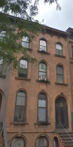 a front view of a house with a lake view