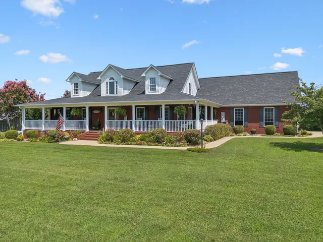 front view of a house with a yard