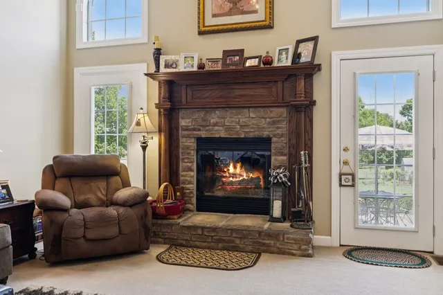 a kitchen with stainless steel appliances granite countertop a stove refrigerator and cabinets