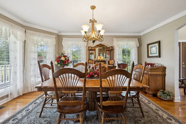 a bedroom with a bed and a large mirror with a flat tv screen