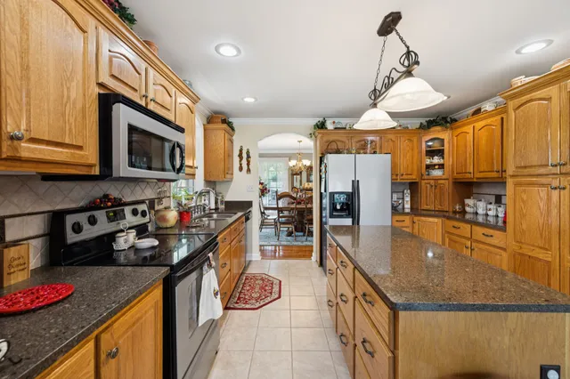 a view of an entryway with wooden floor and windows
