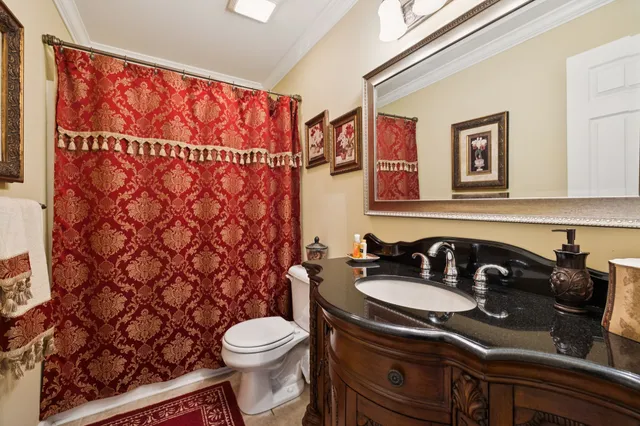 a view of a patio with table and chairs under an umbrella