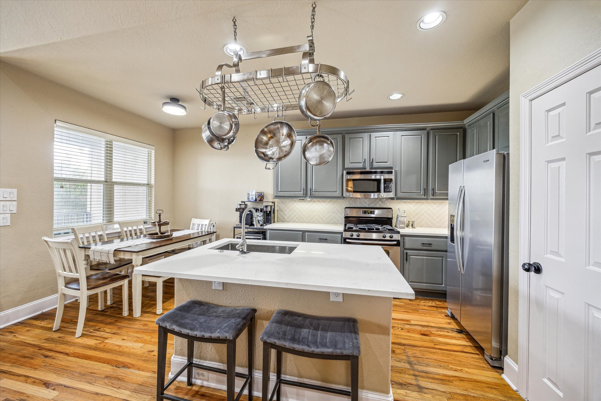 210 Grove Street Houston, TX 77020 - Photo 9 of 28 a kitchen with stainless steel appliances granite countertop a sink stove and refrigerator