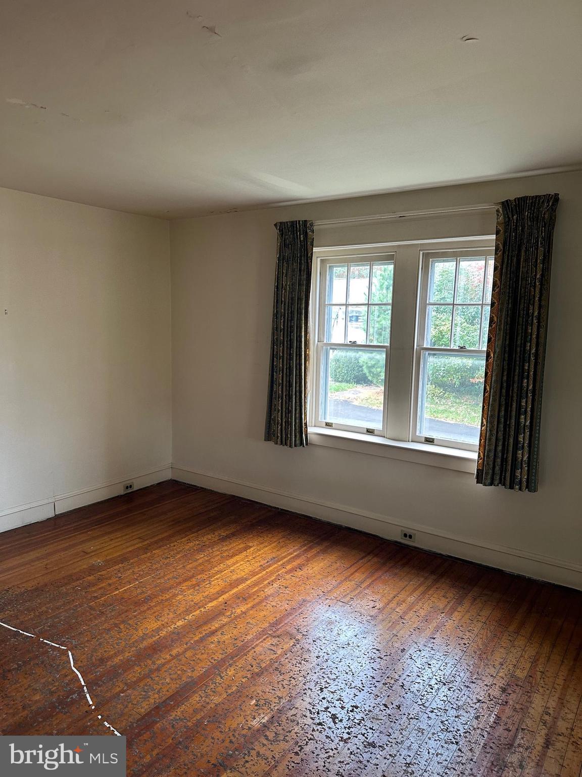 116 North Main Street Hatfield, PA 19440 - Photo 12 of 23 a view of an empty room with wooden floor and a window