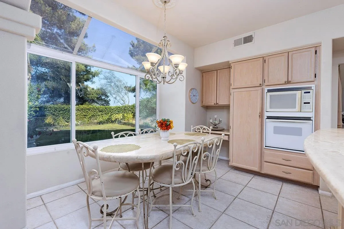 1690 West 11th Avenue Escondido, CA 92029 - Photo 11 of 25 a view of a dining room with furniture window and outside view