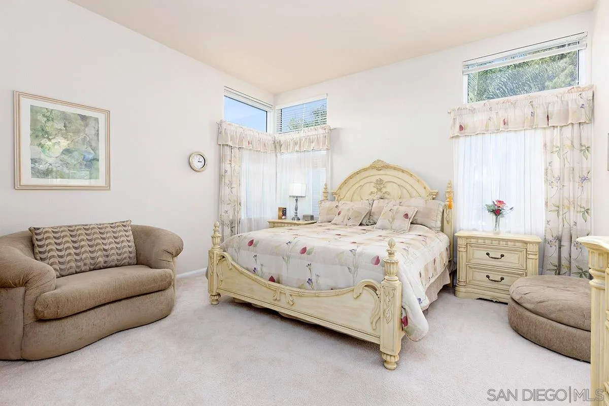 1690 West 11th Avenue Escondido, CA 92029 - Photo 16 of 25 a bedroom with a bed couch and window
