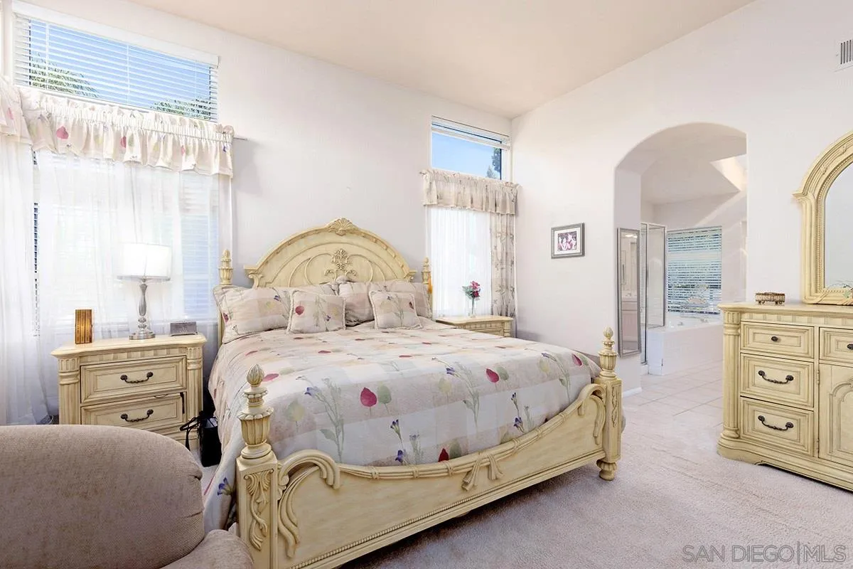 1690 West 11th Avenue Escondido, CA 92029 - Photo 17 of 25 a bedroom with a bed and a dresser