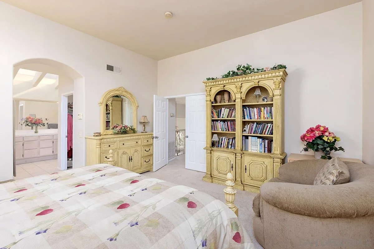 1690 West 11th Avenue Escondido, CA 92029 - Photo 18 of 25 a bed room with a bed and a dresser