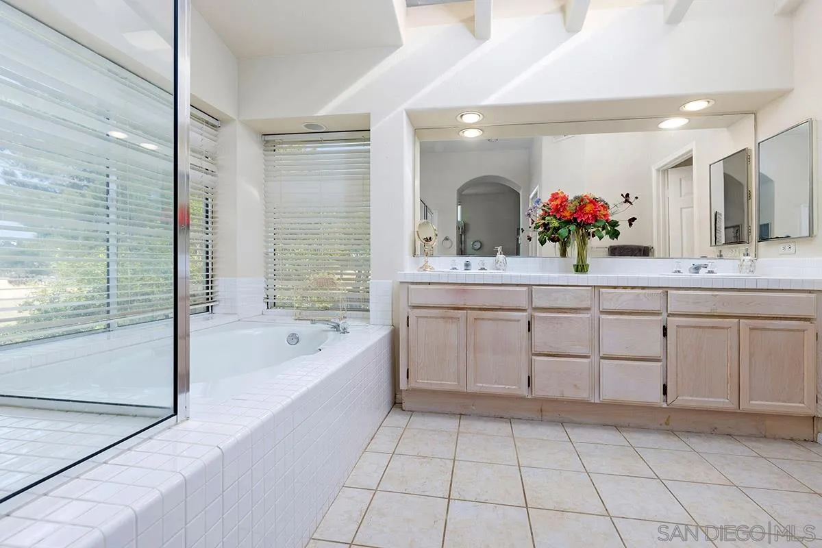 1690 West 11th Avenue Escondido, CA 92029 - Photo 19 of 25 a spacious bathroom with a sink mirror and bathtub