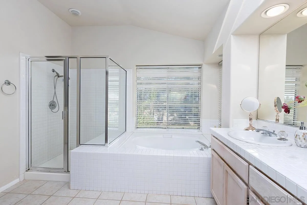 1690 West 11th Avenue Escondido, CA 92029 - Photo 20 of 25 a bathroom with a tub sink and shower