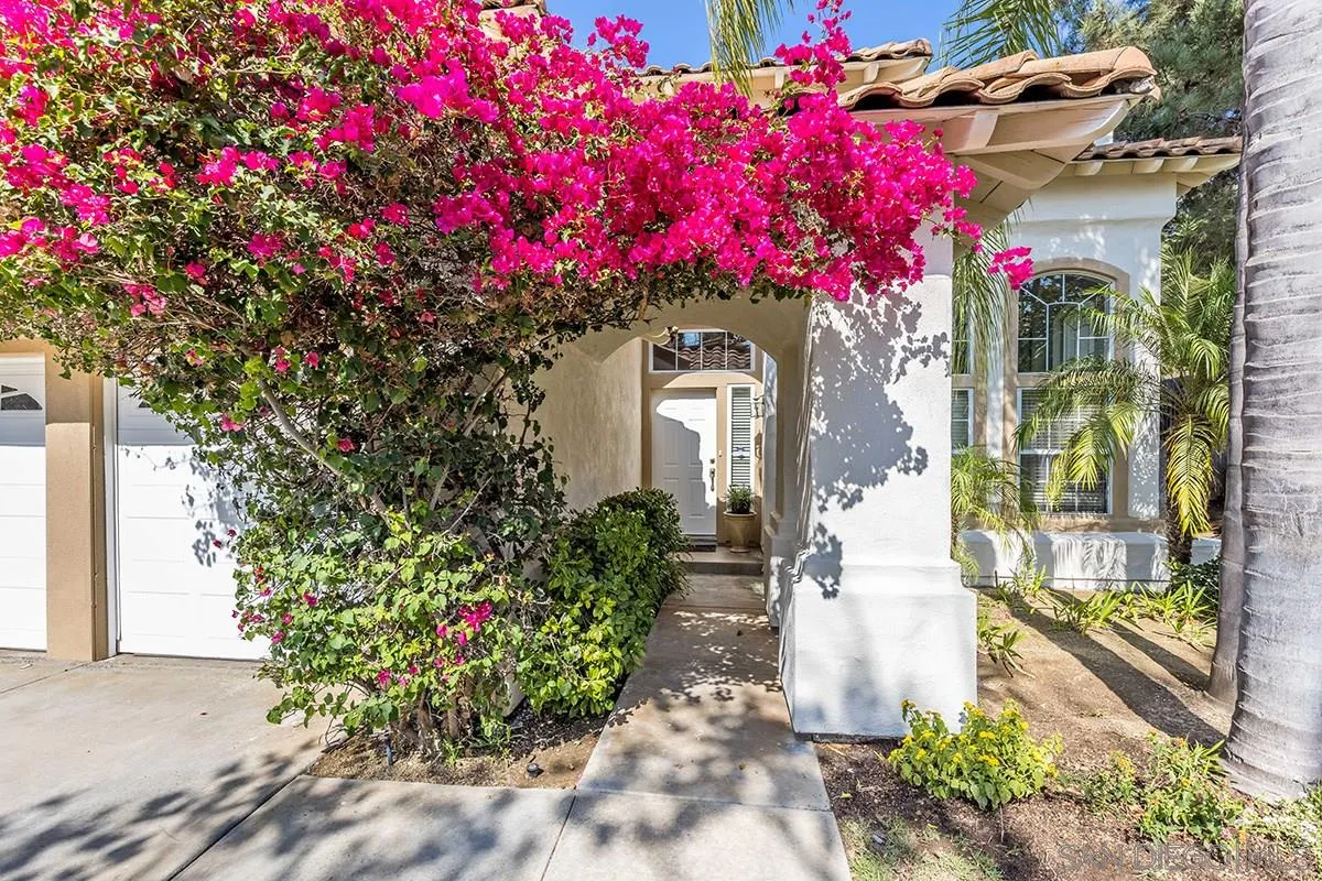 1690 West 11th Avenue Escondido, CA 92029 - Photo 2 of 25 a front view of a house with flower plants