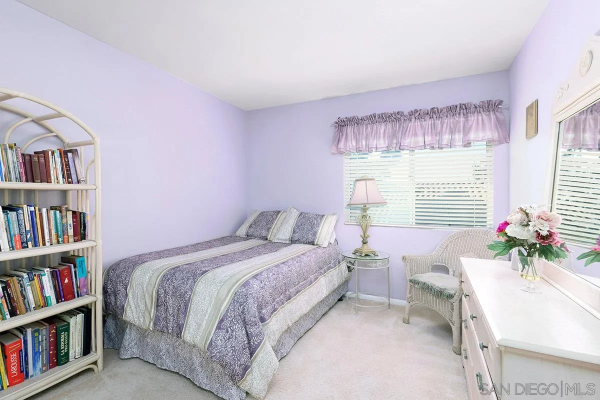 1690 West 11th Avenue Escondido, CA 92029 - Photo 23 of 25 a bedroom with a bed furniture and a book shelf
