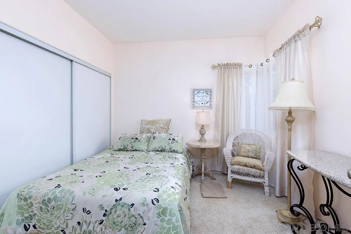 1690 West 11th Avenue Escondido, CA 92029 - Photo 24 of 25 a bedroom with a bed and a table