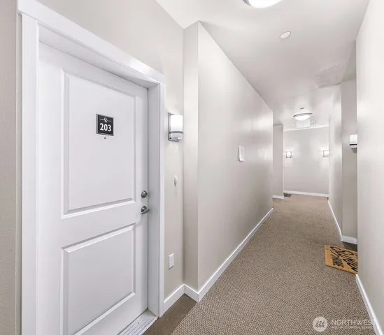 a kitchen with a table and chairs in it