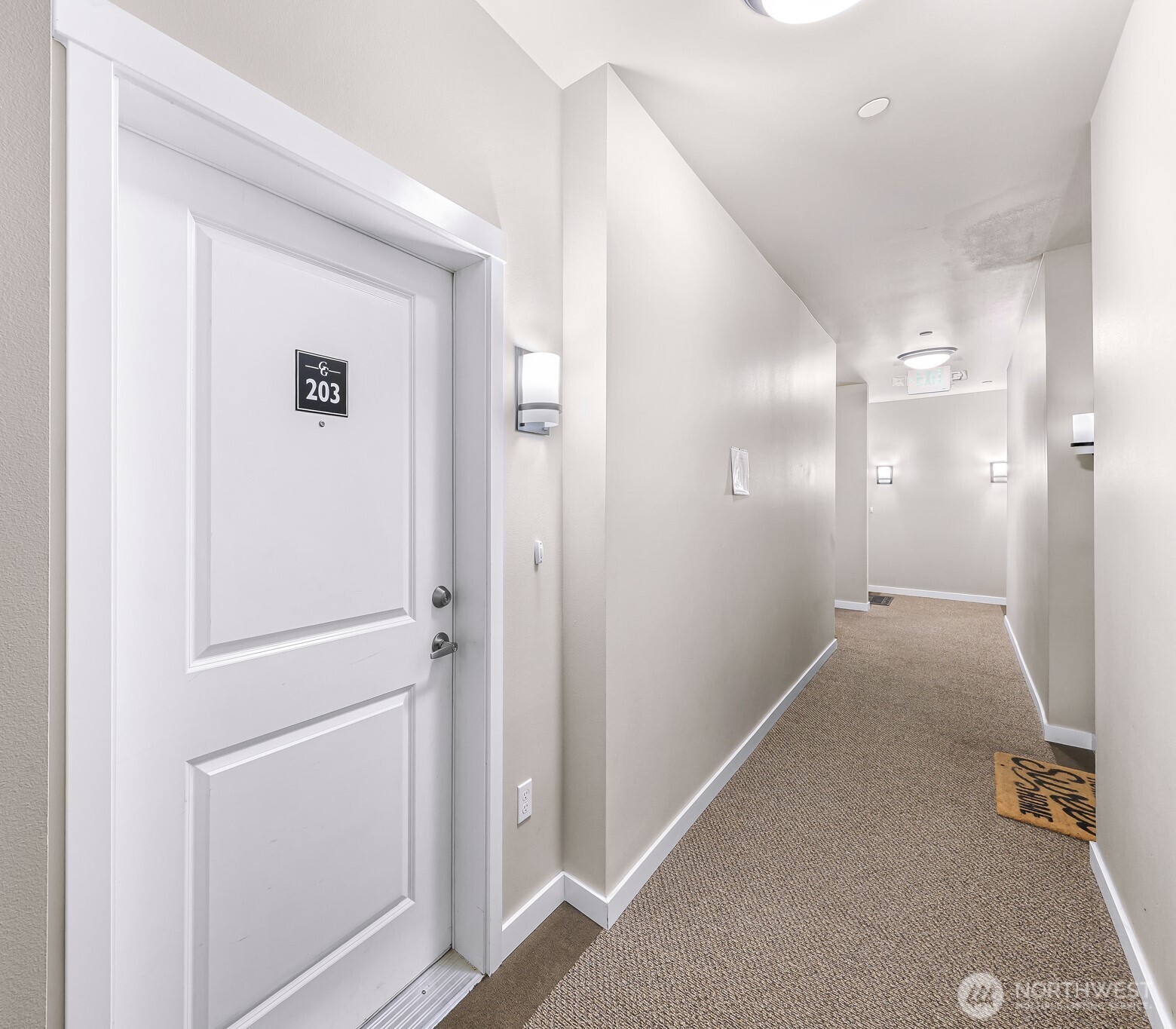 8872 Depot Road, Unit 203 Lynden, WA 98264 - Photo 11 of 15 a view of a hallway with wooden floor