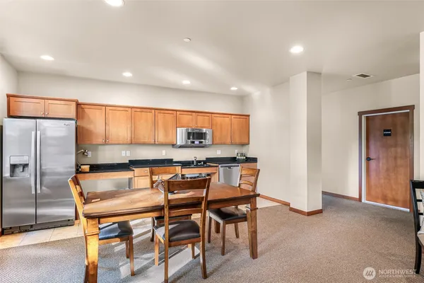 a kitchen with a table and chairs in it