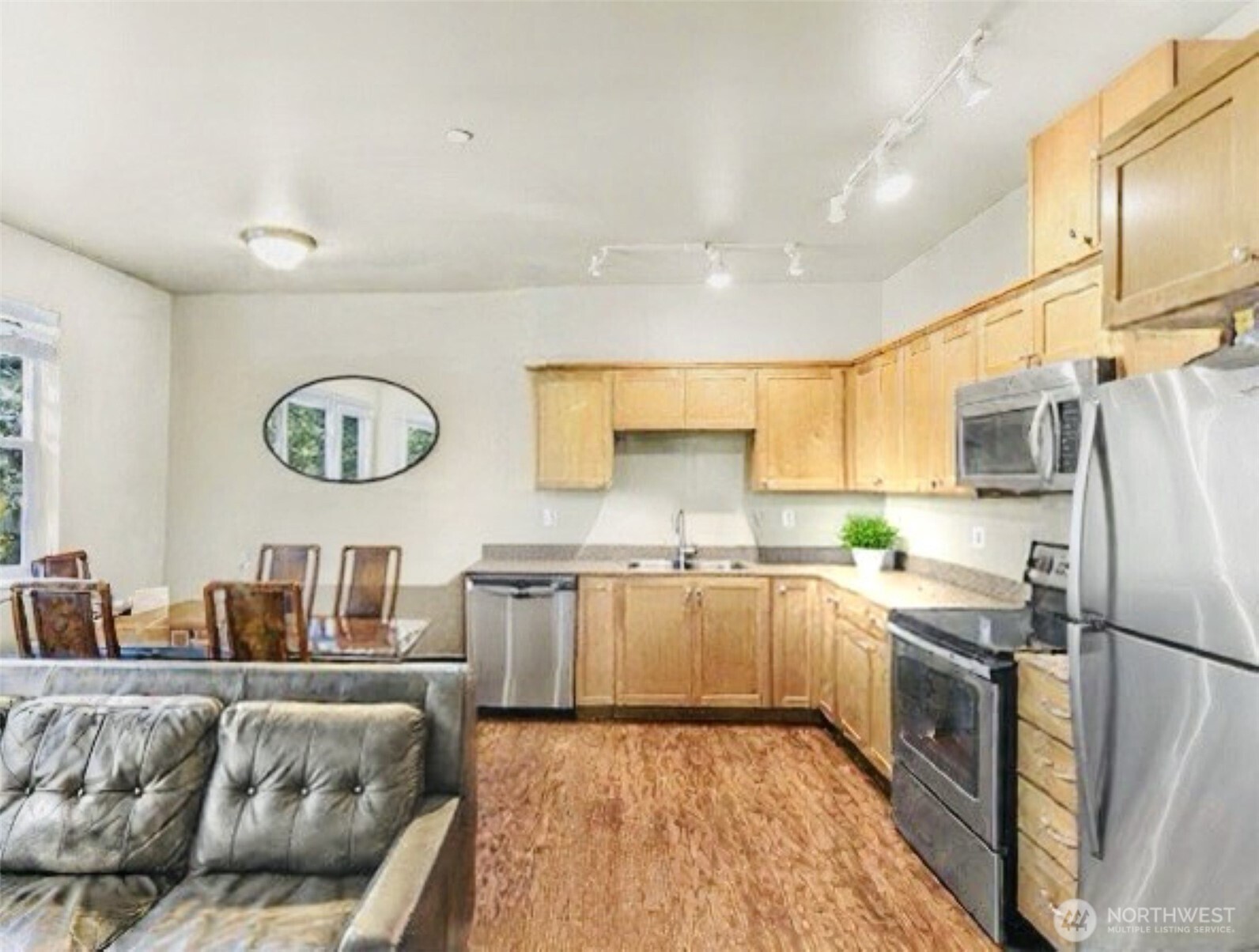 8872 Depot Road, Unit 203 Lynden, WA 98264 - Photo 6 of 15 a kitchen with stainless steel appliances granite countertop a refrigerator and a stove top oven