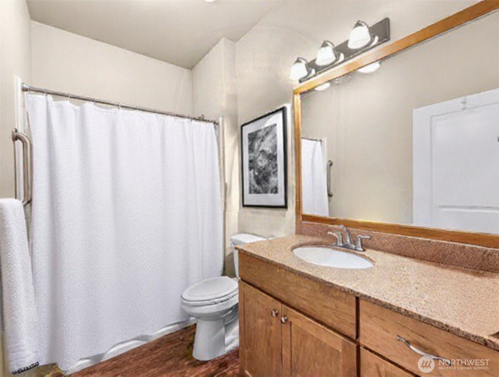 8872 Depot Road, Unit 203 Lynden, WA 98264 - Photo 9 of 15 a bathroom with a granite countertop sink and a mirror