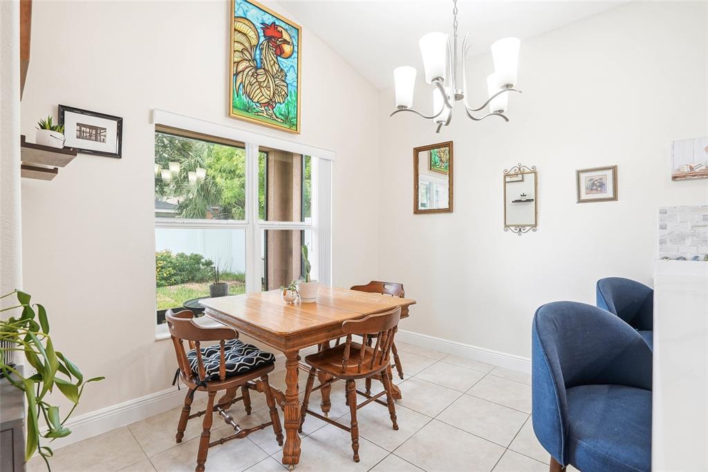 2906 West Douglas Street Tampa, FL 33607 - Photo 9 of 36 a view of a dining room with furniture and a large window