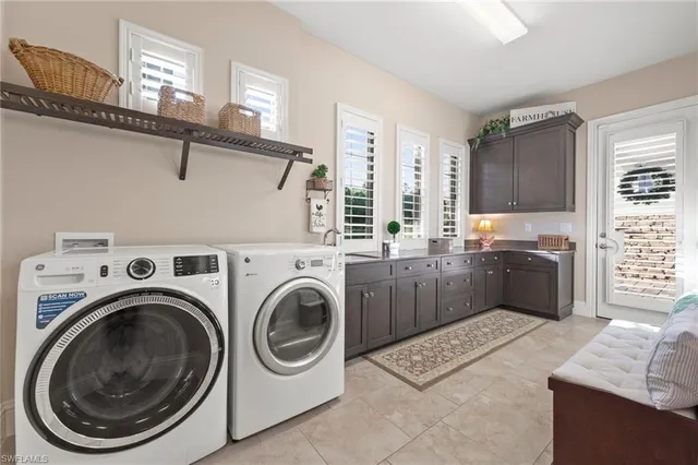 a kitchen with a washer and dryer
