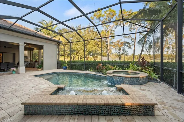 a view of swimming pool with outdoor seating