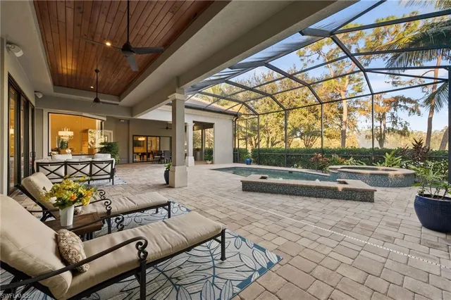 a dining room with furniture window and fireplace