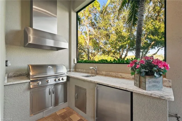 a view of a house with a big yard and palm trees