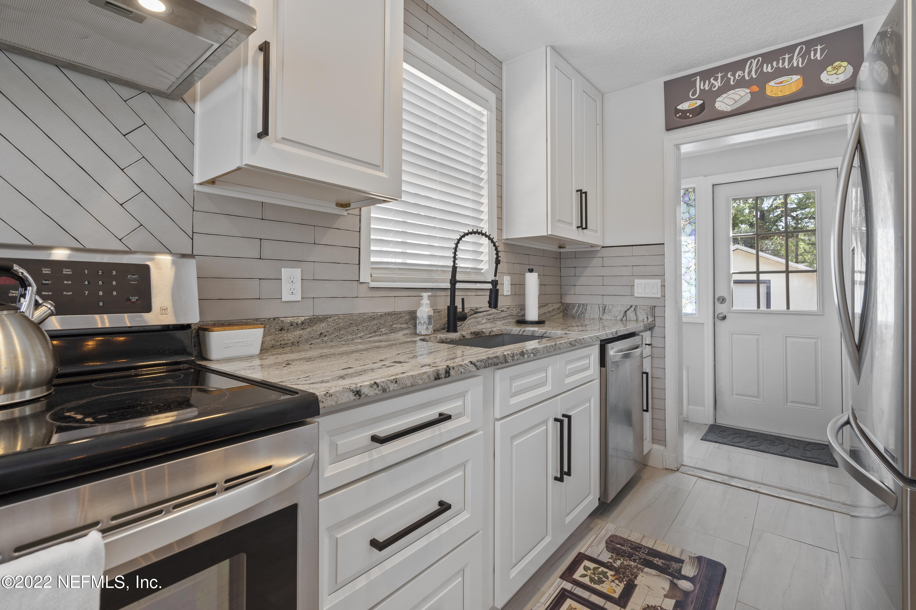 1655 Charon Road Jacksonville, FL 32205 - Photo 6 of 26 kitchen/back door